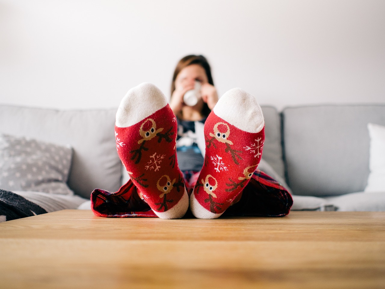 woman with feet up on coffee table